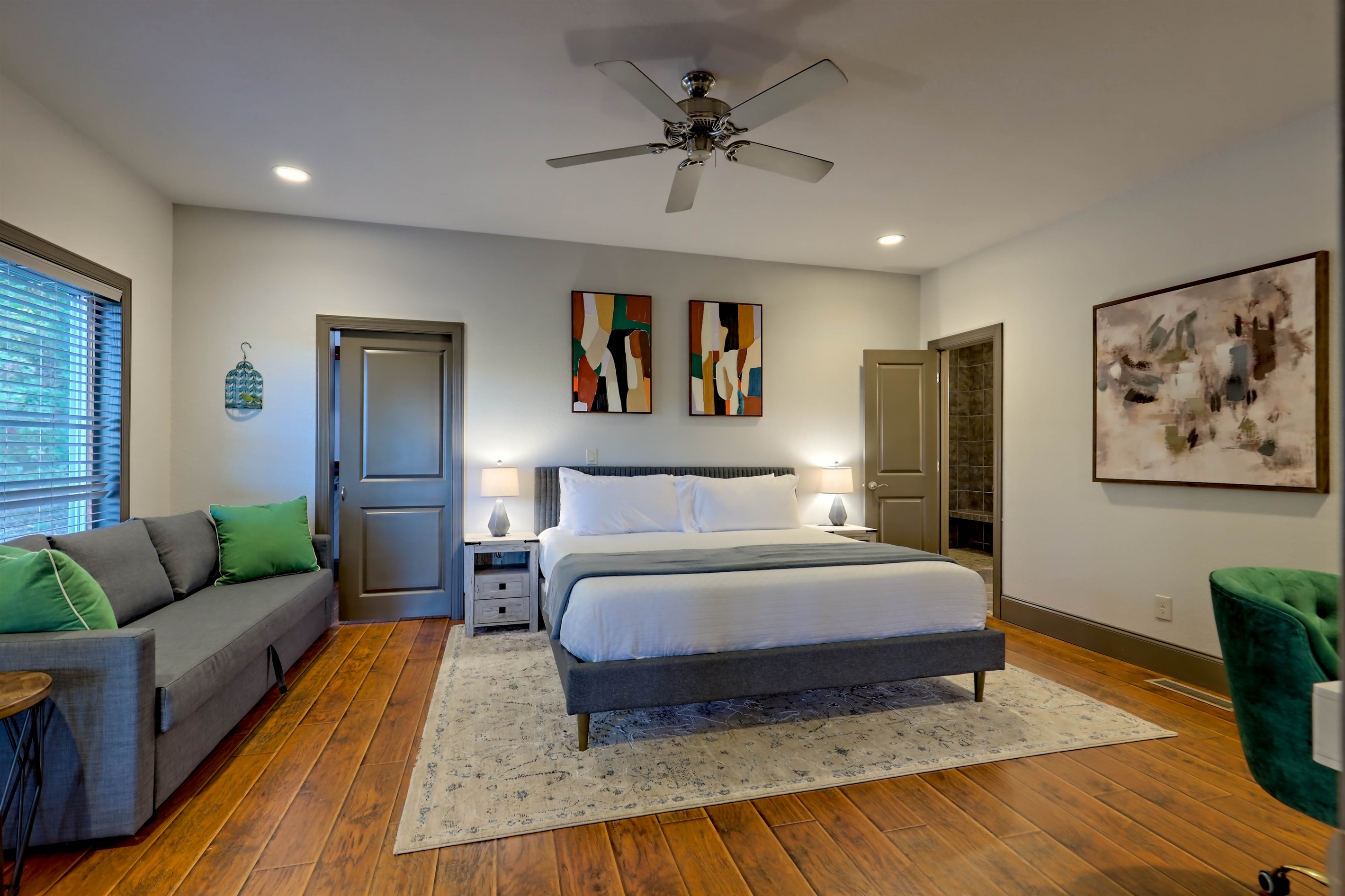 Comfortable master bedroom with king bed, desk, attached bathroom