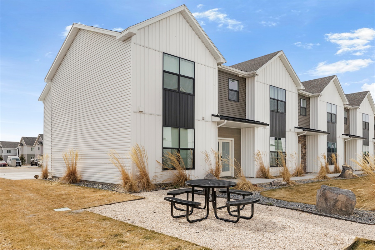Front yard with outdoor seating.