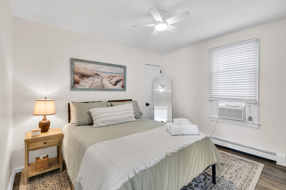 Stretch out in a restful second room with soft bedding and a bedside lamp. Pull the AC on, dim the light, and drift off after a full day by the water.