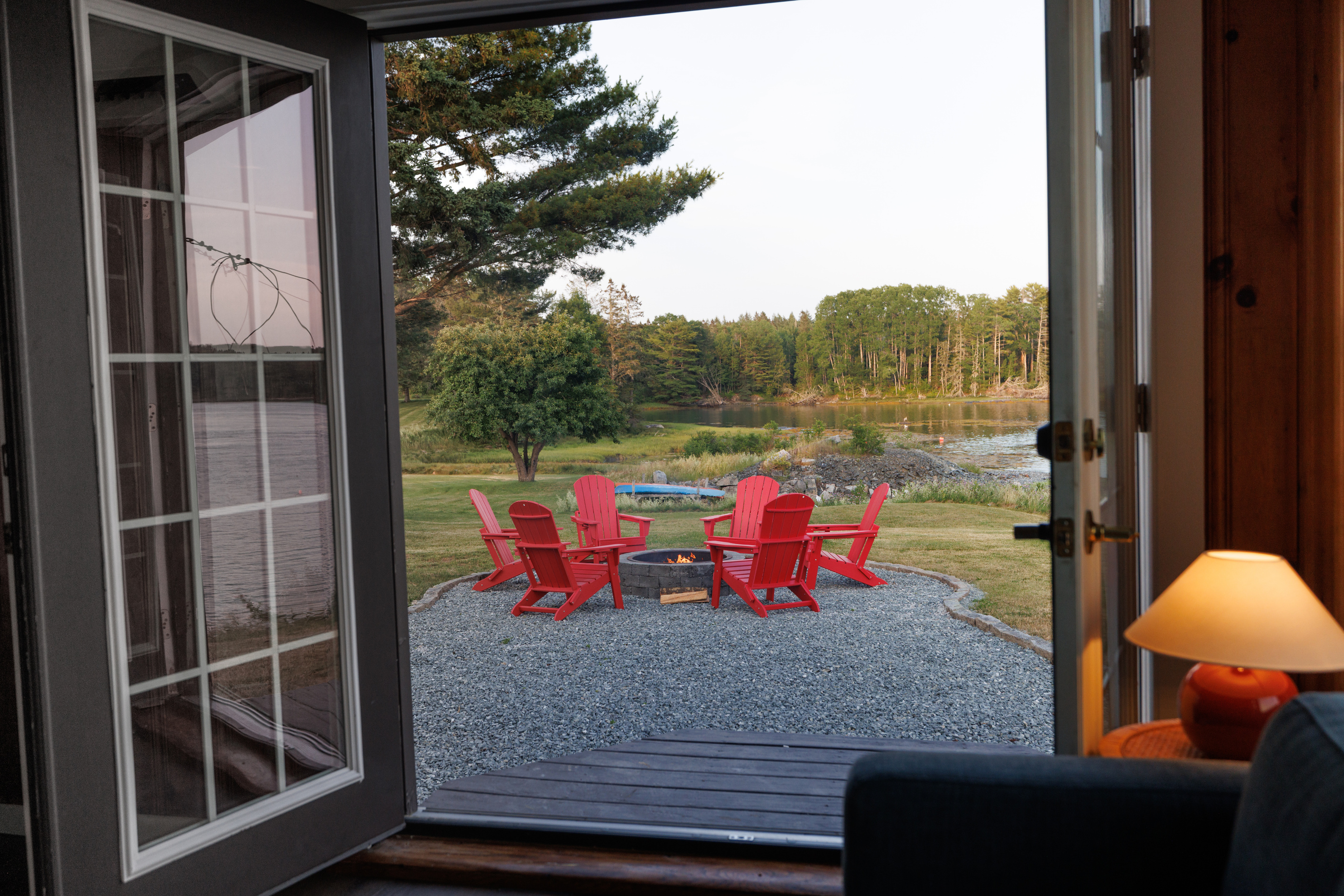 Walk the property from the house to the cove — manicured lawn, every outdoor amenity in clear view, the whole retreat spread out in front of you.