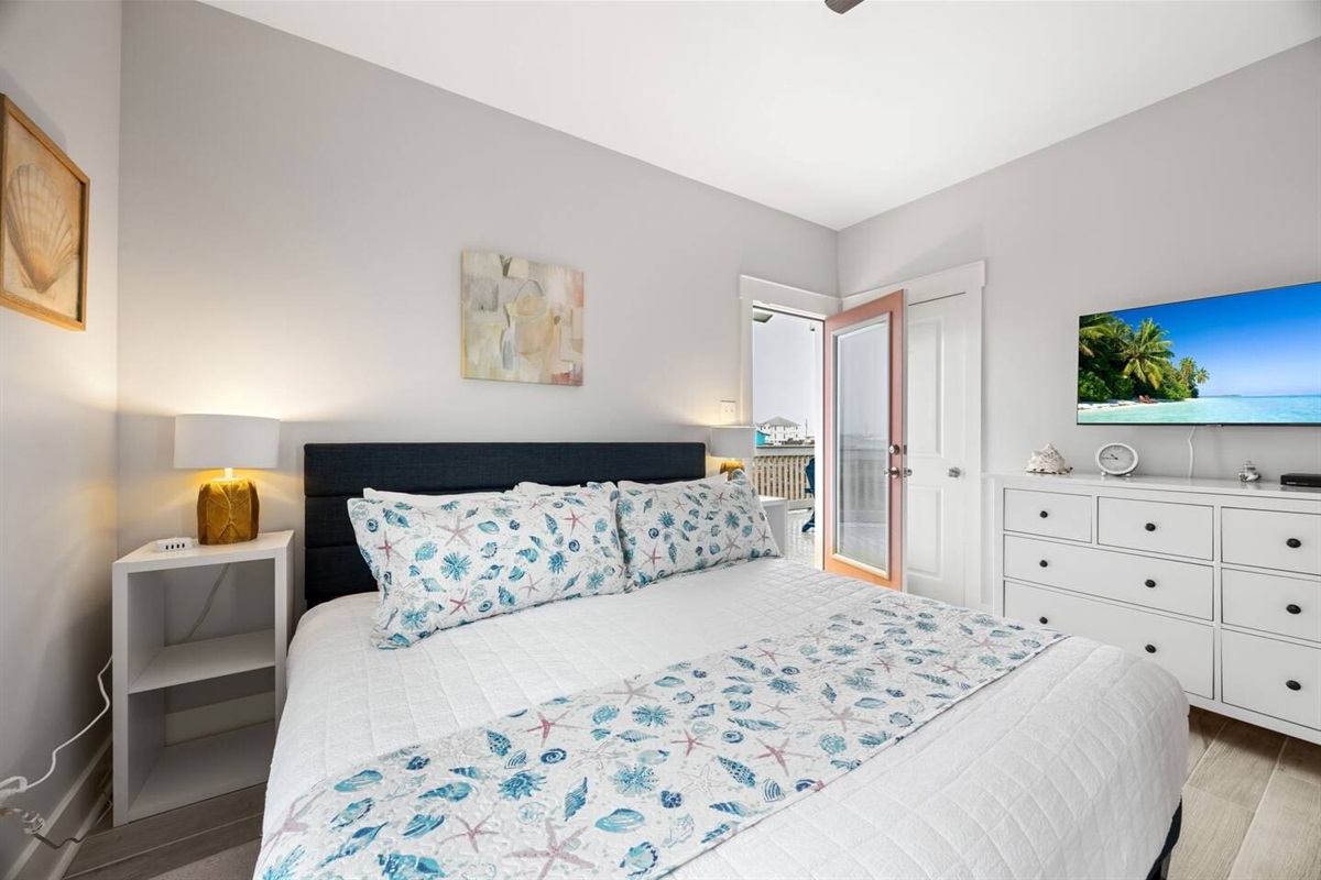 Left Master Suite with access to back porch and TV streaming Netflix and GoogleTV