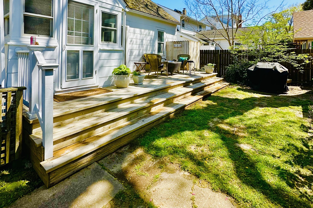 Back entrance near parking. Back porch outdoor shower and grill