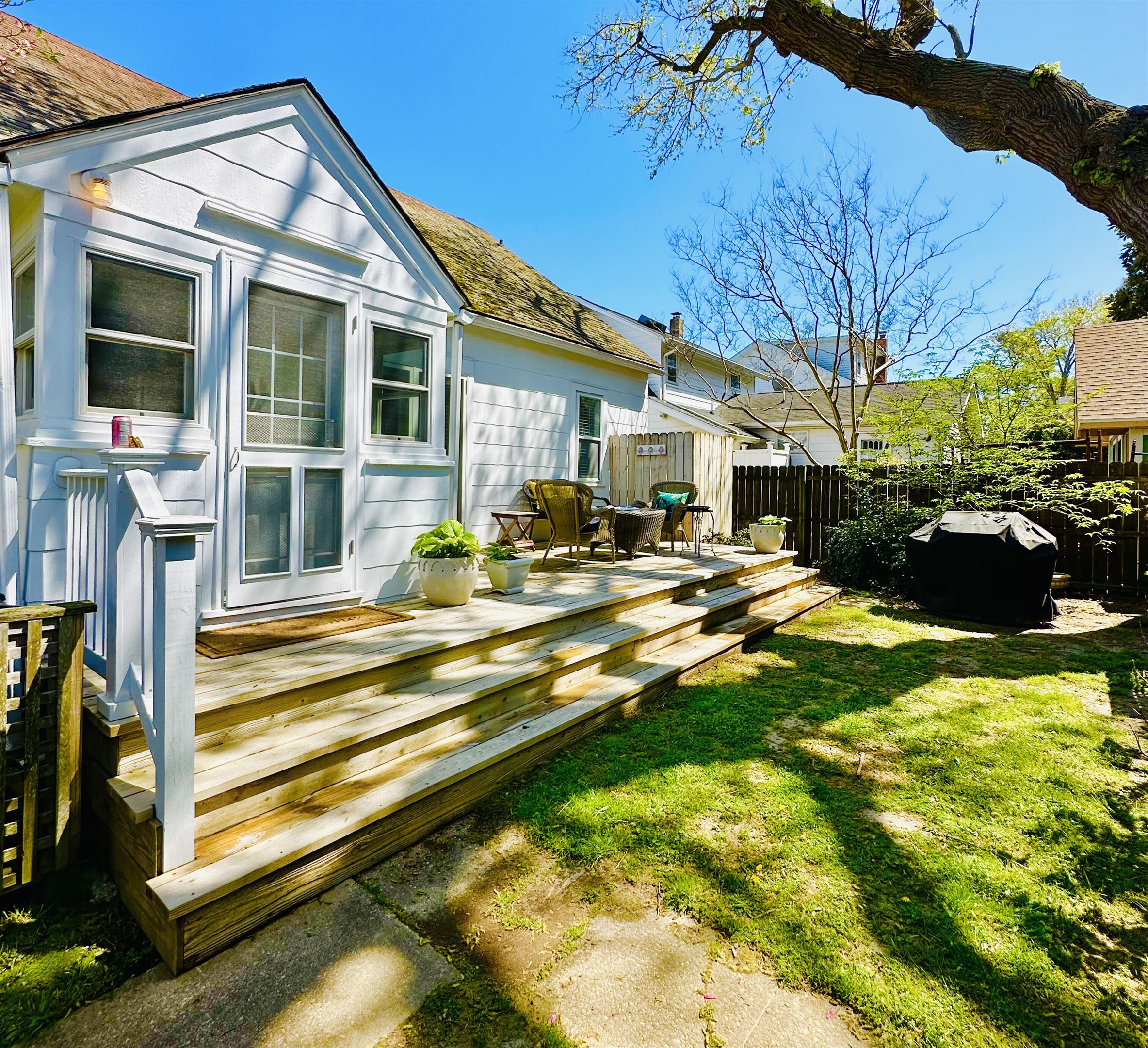 Back entrance near parking. Back porch outdoor shower and grill