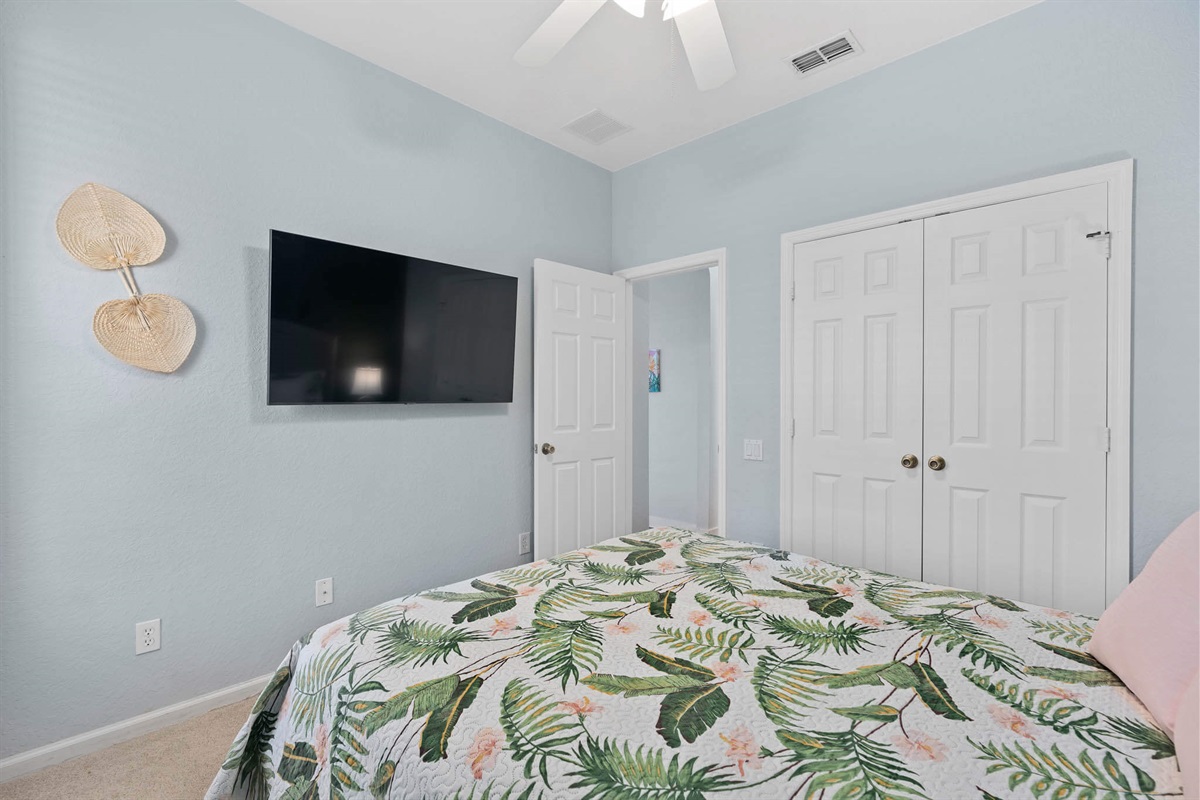 Downstairs queen bedroom with 55" TV - Now with luxury vinyl flooring!
