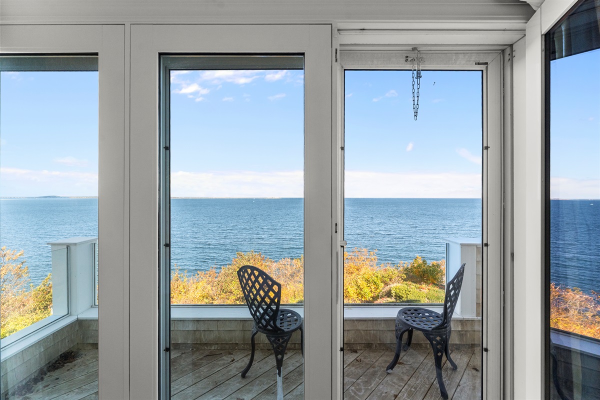 Serene ocean views from the comfortable queen bed upstairs.
