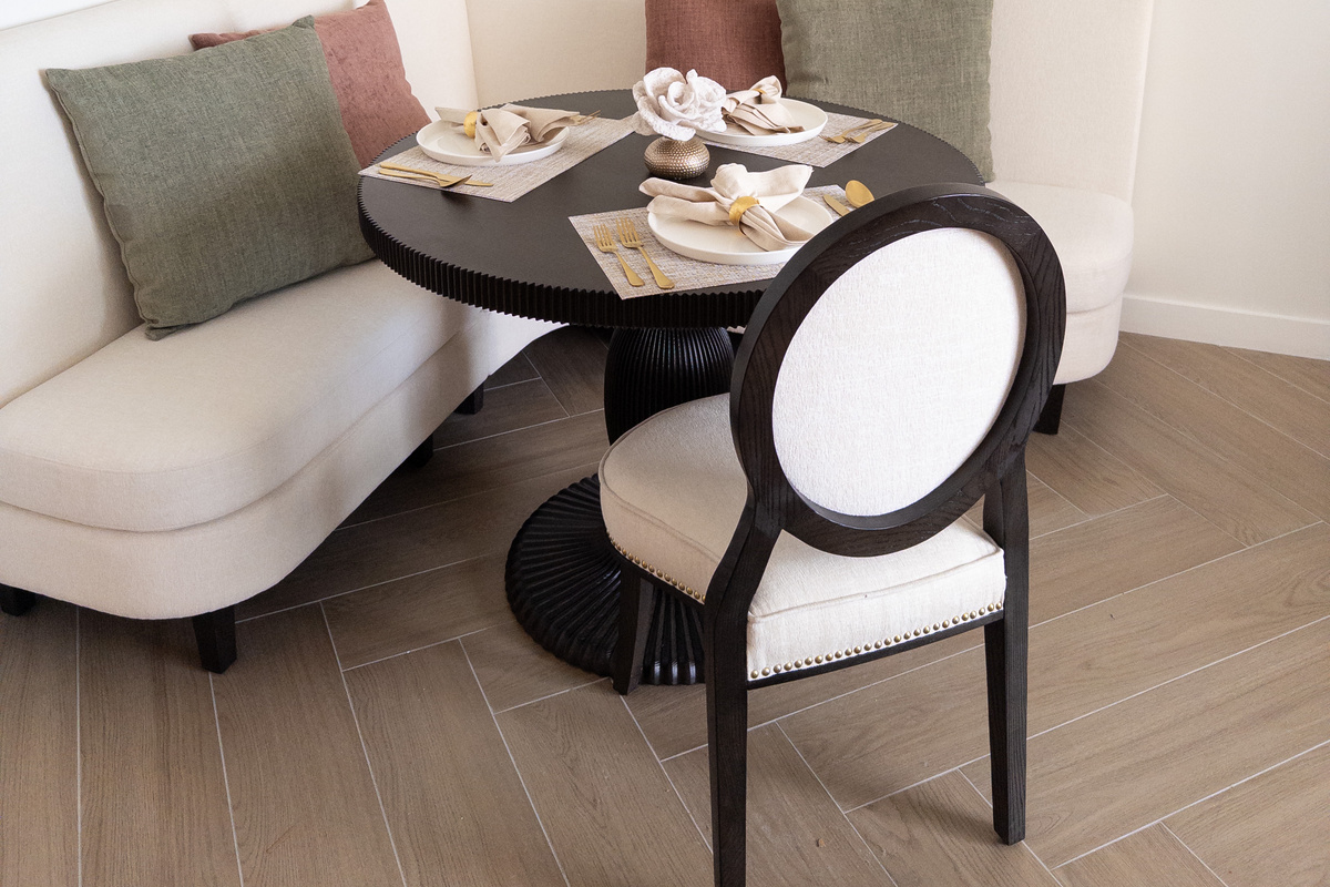 An intimate dining corner - bistro seating bathed in natural light.