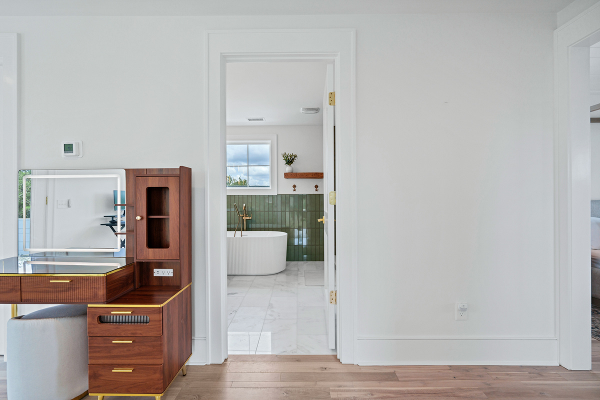 Main Suite Entrance to En-Suite Bath with Makeup Vanity and Lighted Mirror