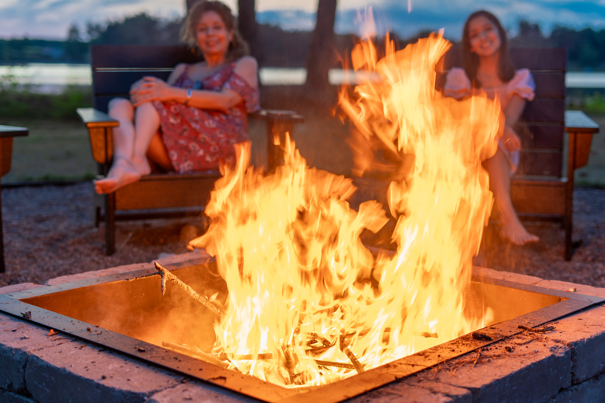 The firepit is lit, the lake is glowing, and everyone is exactly where they should be. Complimentary firewood included - every stay