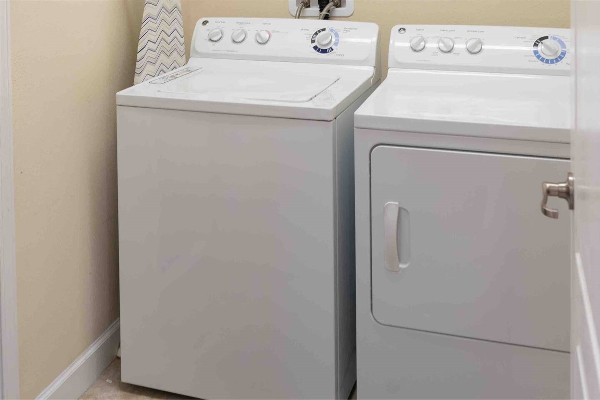 Washer and dryer with ironing board and iron