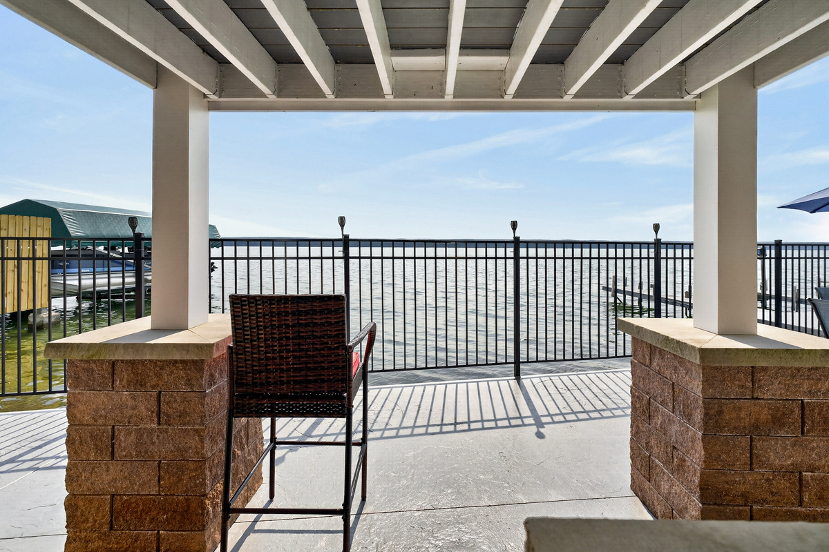 Waterfront patio with shaded lounge area