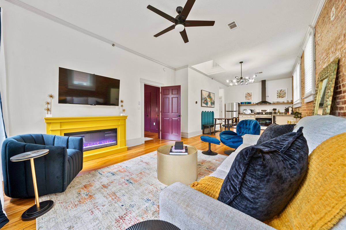 This angle highlights the seamless integration of the living and dining areas, creating a welcoming and functional layout.