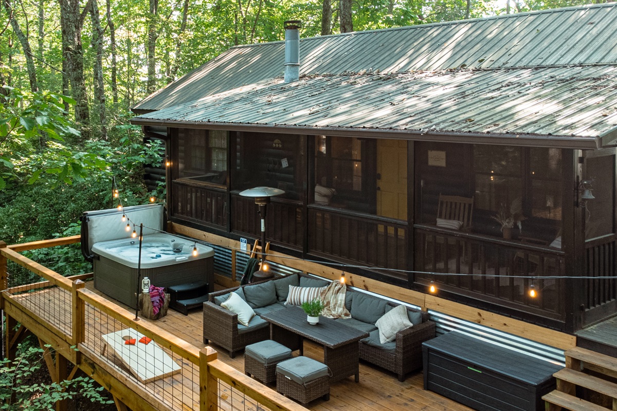 Relax under the trees on the large outdoor deck