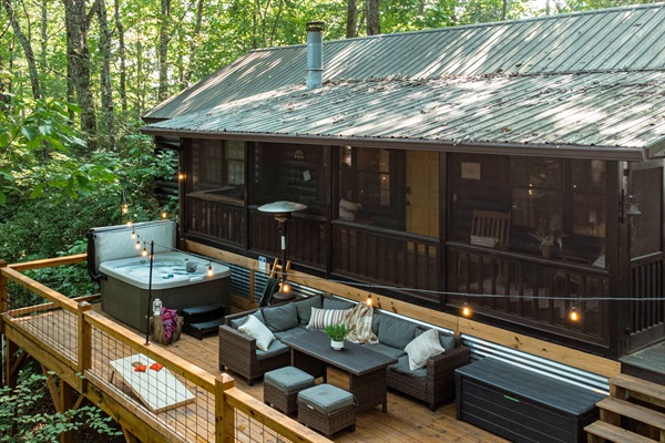 Relax under the trees on the large outdoor deck