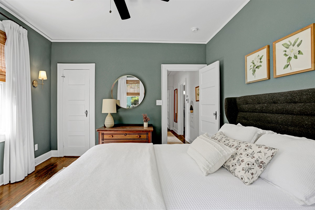 The mossy green hues paired with soft lighting create a peaceful, welcoming retreat.