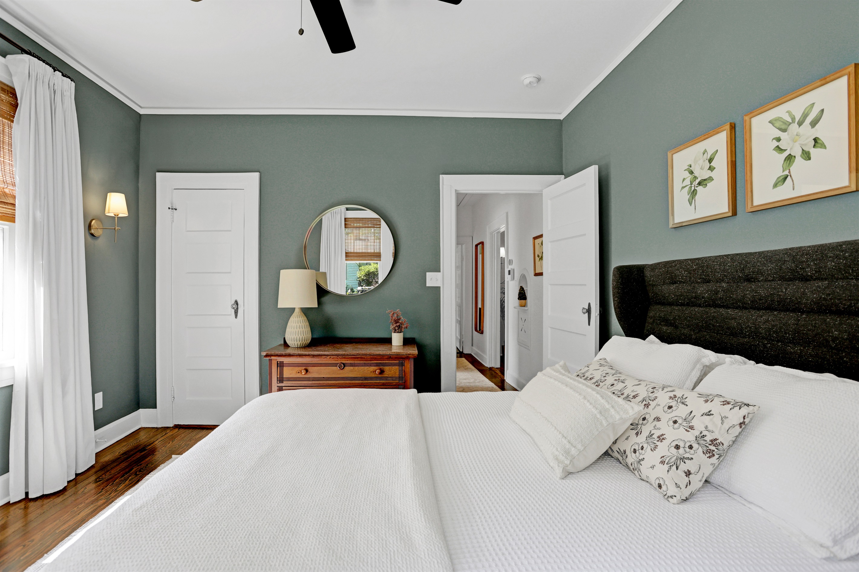 The mossy green hues paired with soft lighting create a peaceful, welcoming retreat.