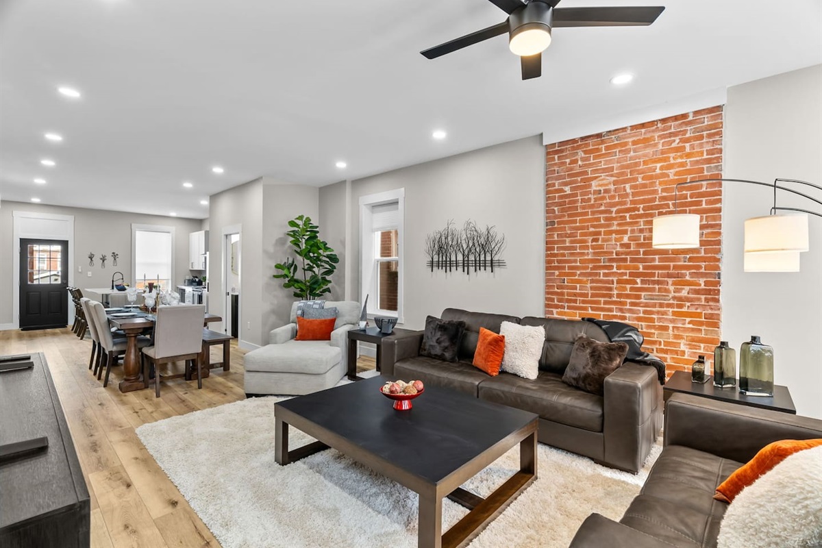 The home boasts a spacious open-concept design with high ceilings, creating a bright and airy atmosphere.