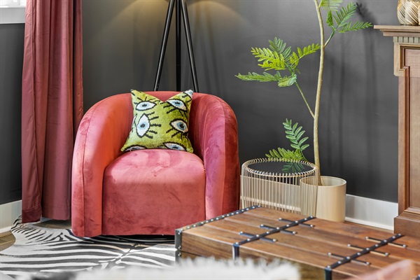 Chic Lounge: Vibrant armchair, playful decor, and a stylish vibe—perfect for relaxation and fun!