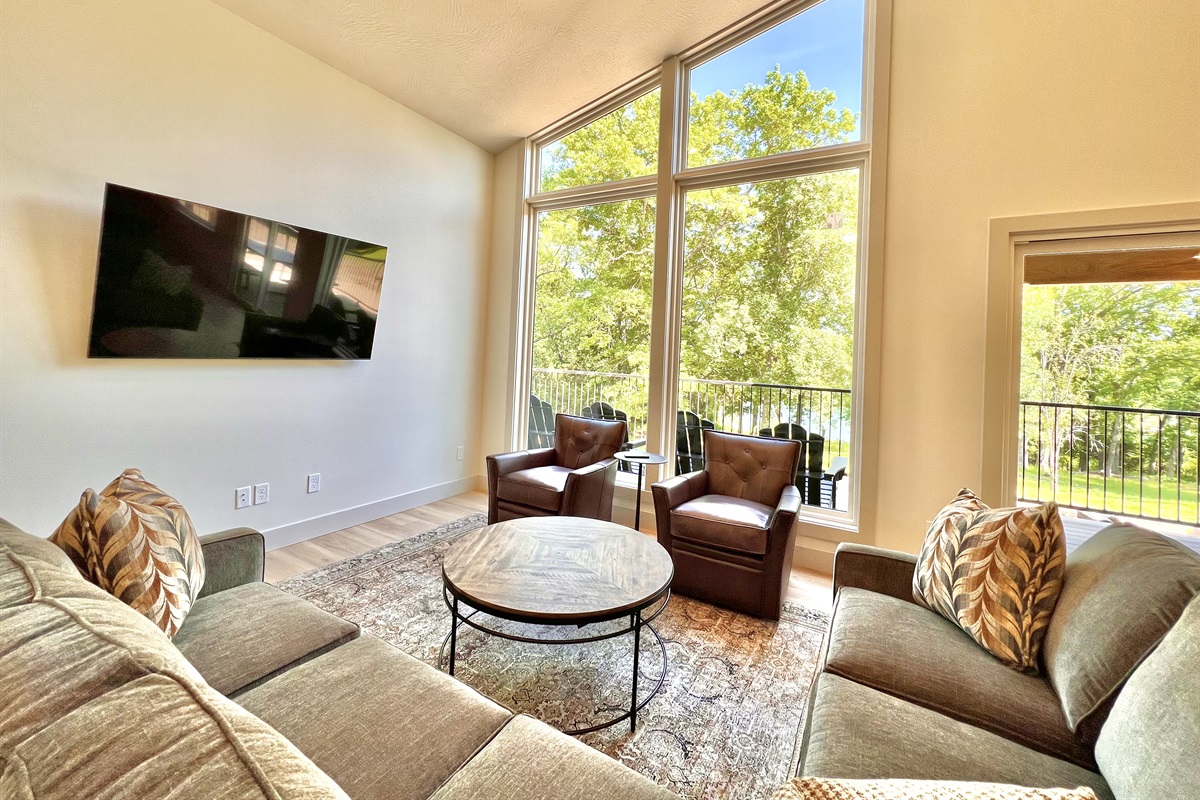 Vaulted ceilings with bright windows and comfy seating