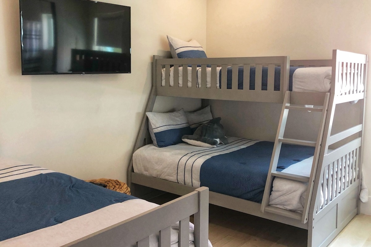Full Bed and 3 Singles, With Attached Bath With Tub/Shower Combination and T.V. 