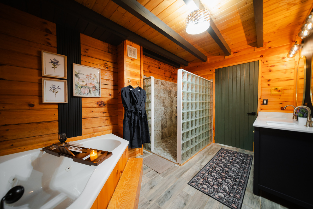 Spacious primary bathroom featuring a relaxing soaking tub - the perfect place to unwind after a day of exploring.
