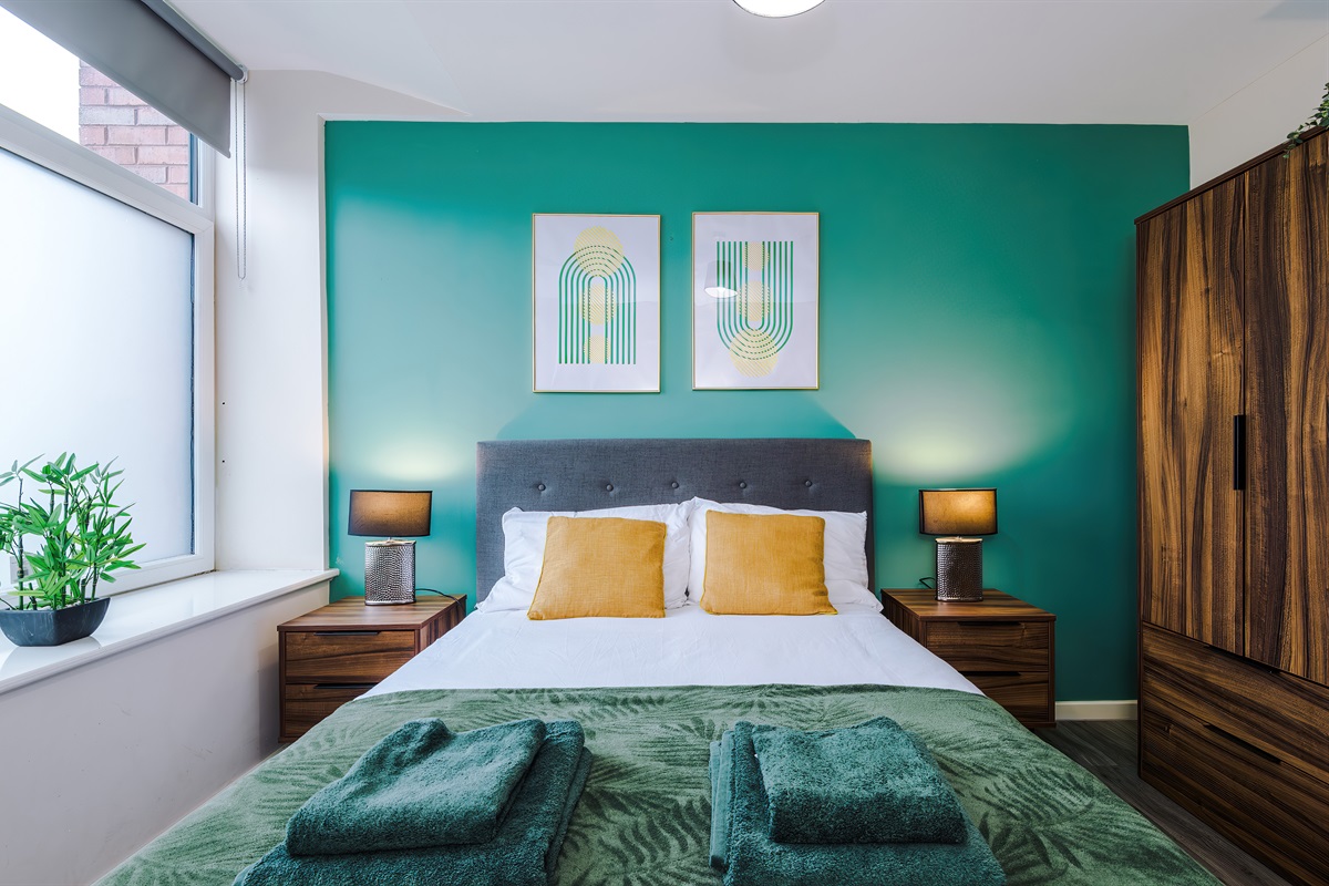 Bedroom 2 benefits from a hotel comfort large double bed, wardrobe with hangers & blackout blinds 