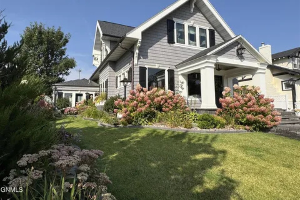 This garden view adds a soft, welcoming touch to the outside of the home.