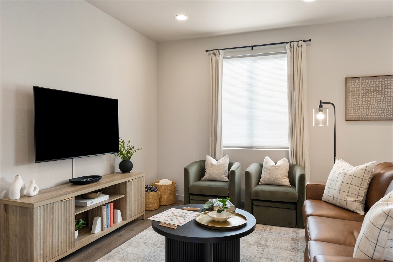 Cozy living room with sofa bed, board games, extra blankets