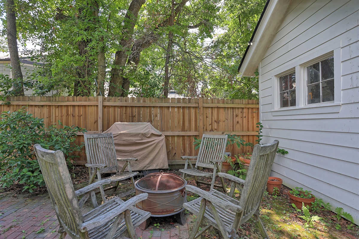Warm up on cooler nights by the charming firepit, a perfect spot for conversation and relaxation.