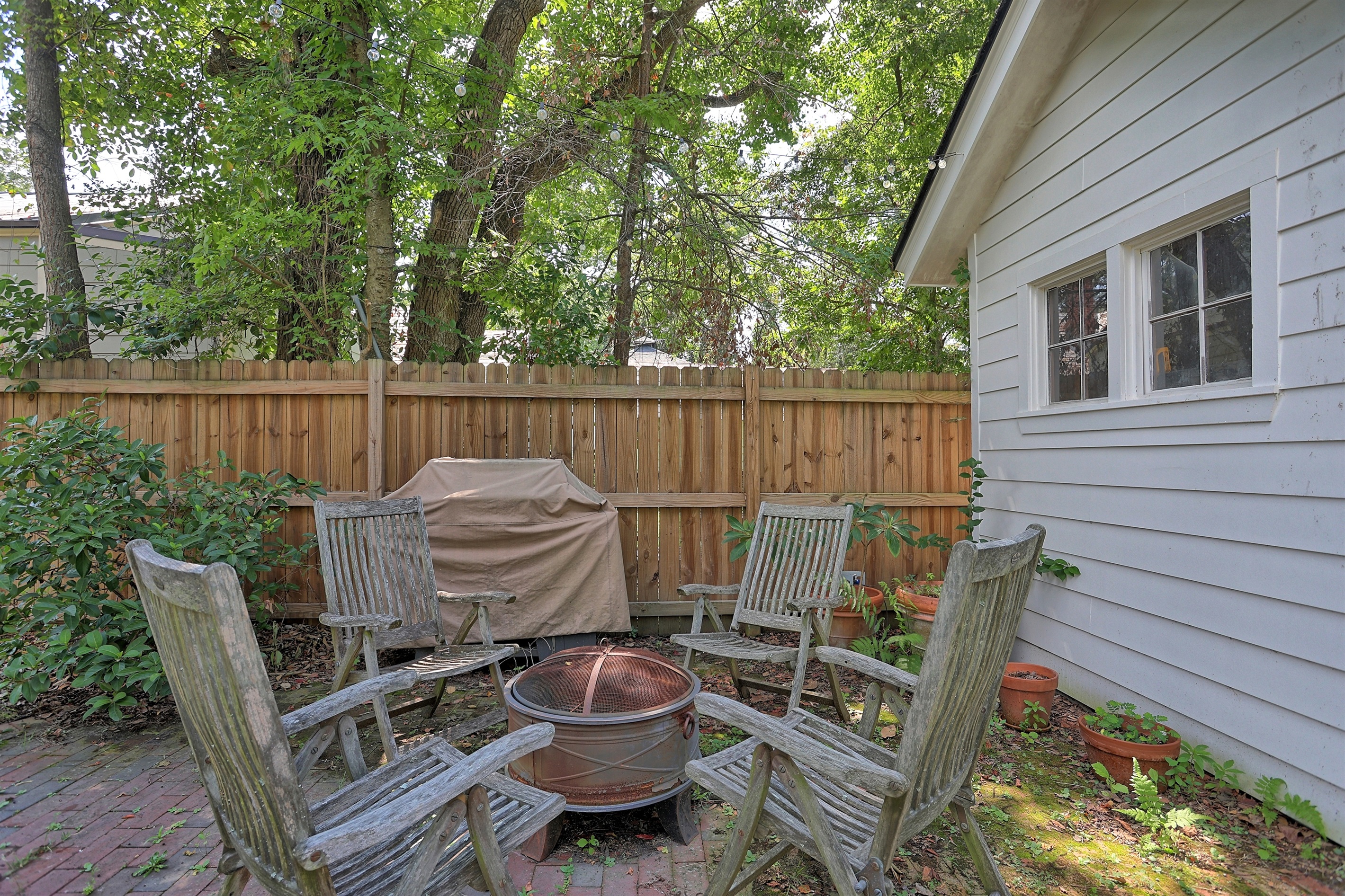 Warm up on cooler nights by the charming firepit, a perfect spot for conversation and relaxation.