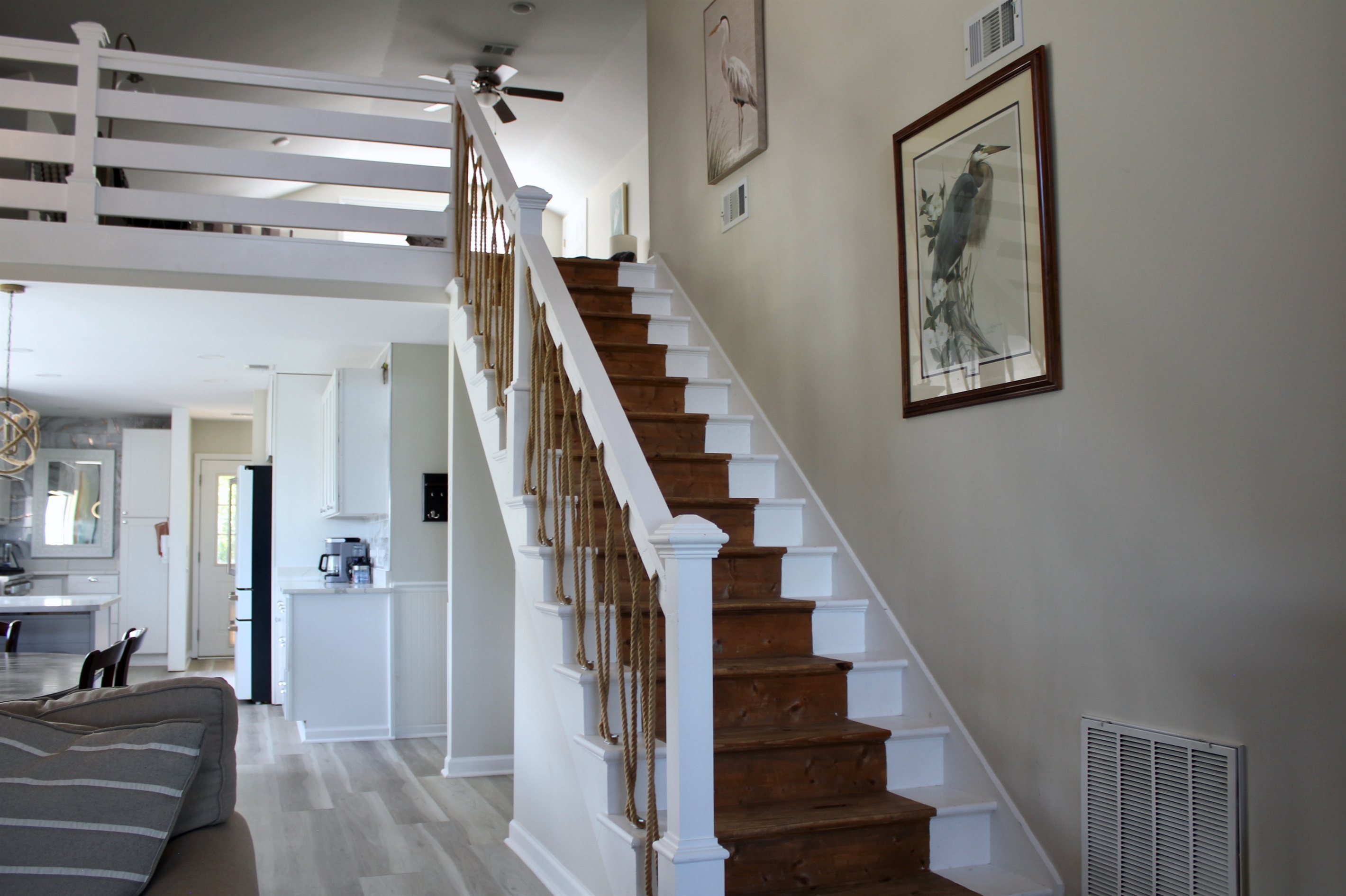 Upstairs loft ahead! A breezy bonus space with a bird’s-eye view of the living room.