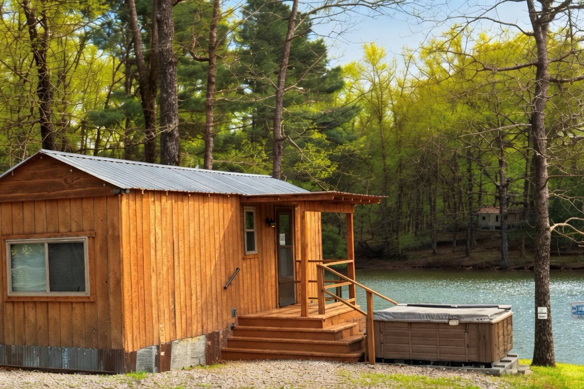Cozy tiny cabin with hot tub overlooking the lake