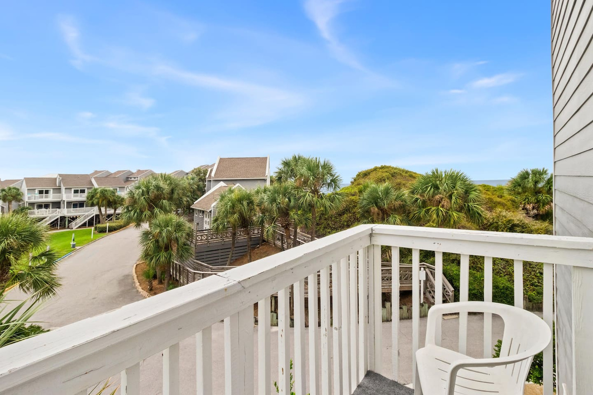 Step onto the queen suite balcony and breathe &mdash; open views and fresh Gulf air greet you.