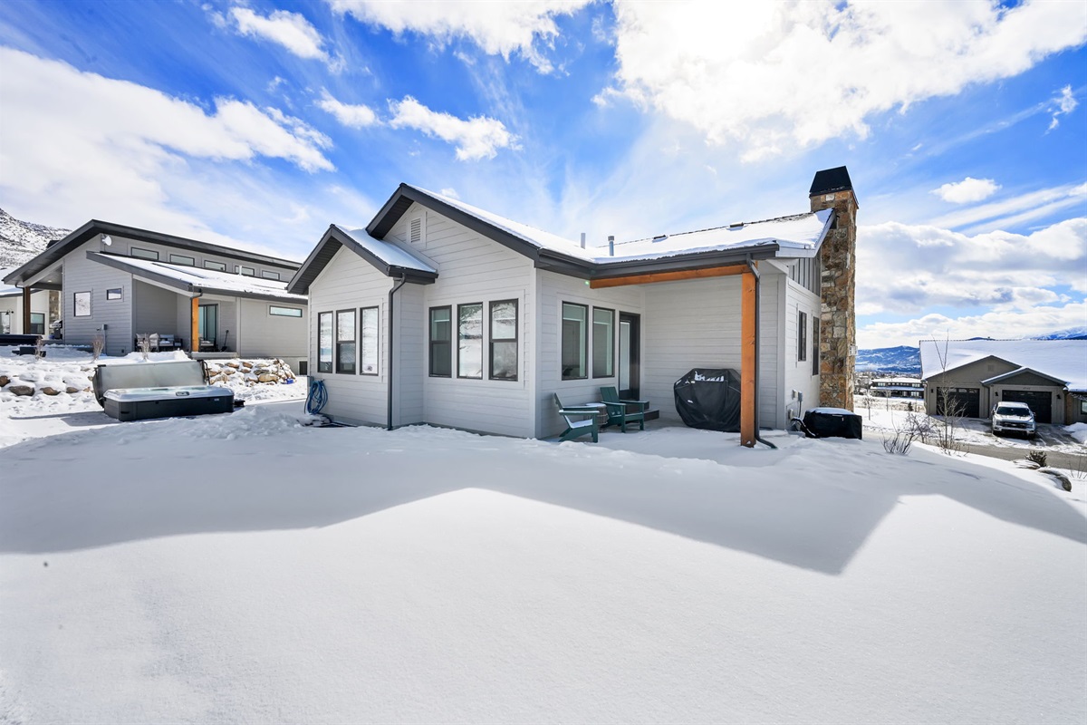 Modern exterior with private patio and beautifully landscaped surroundings.