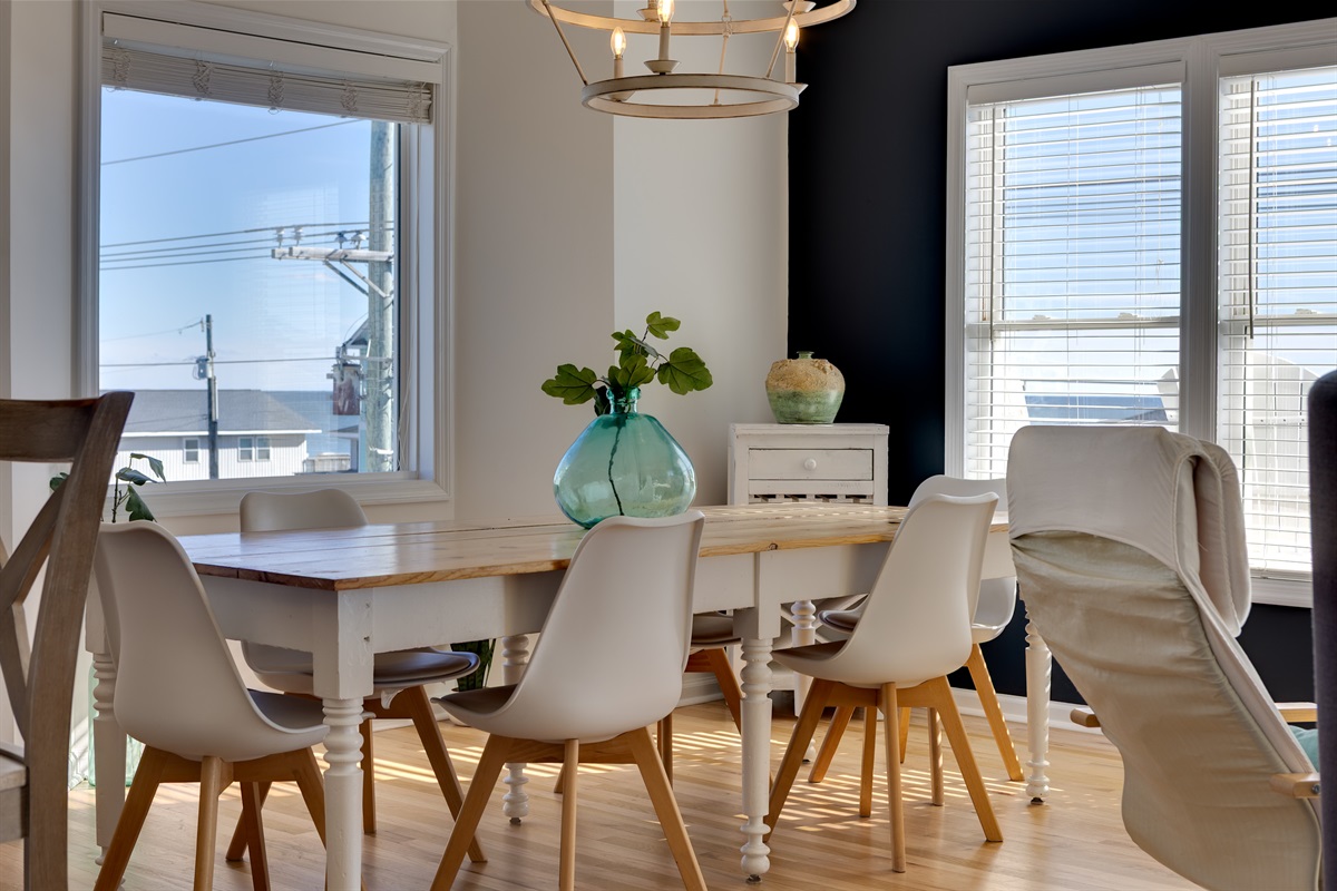 Bright coastal dining nook with seating for the whole group!