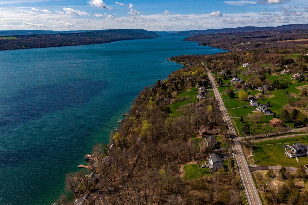 Breathtaking views of Canandaigua Lake, where sparkling blue waters meet rolling hills—perfect for peaceful mornings, sunset strolls, and unforgettable lakeside moments.