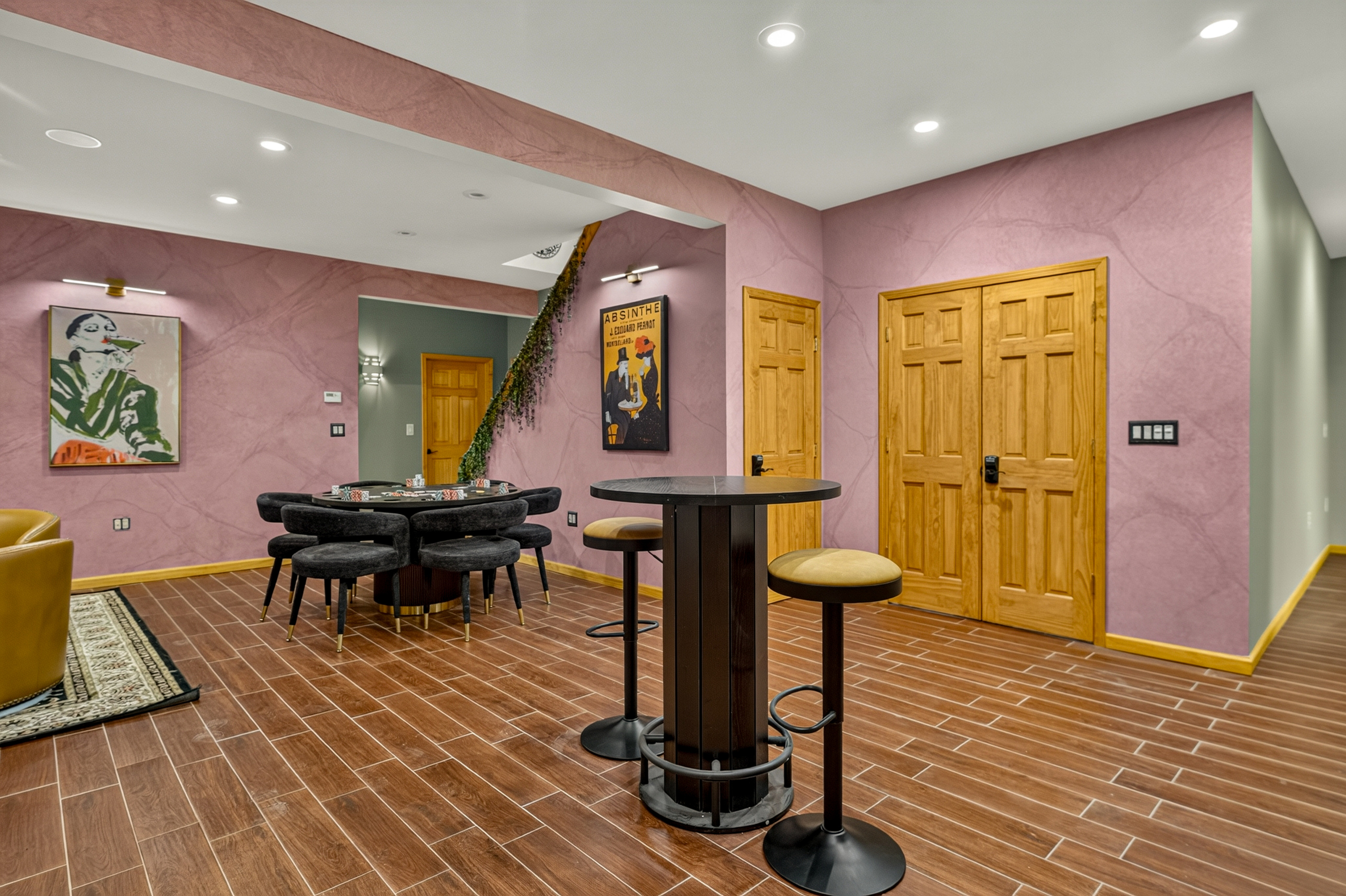 Entertainment space with bar seating and poker table