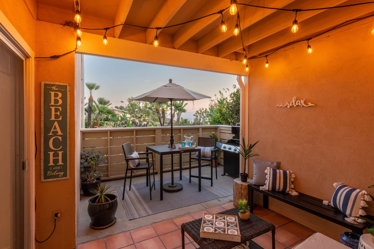 Enjoy the outdoors in this spacious private patio with an ocean view 