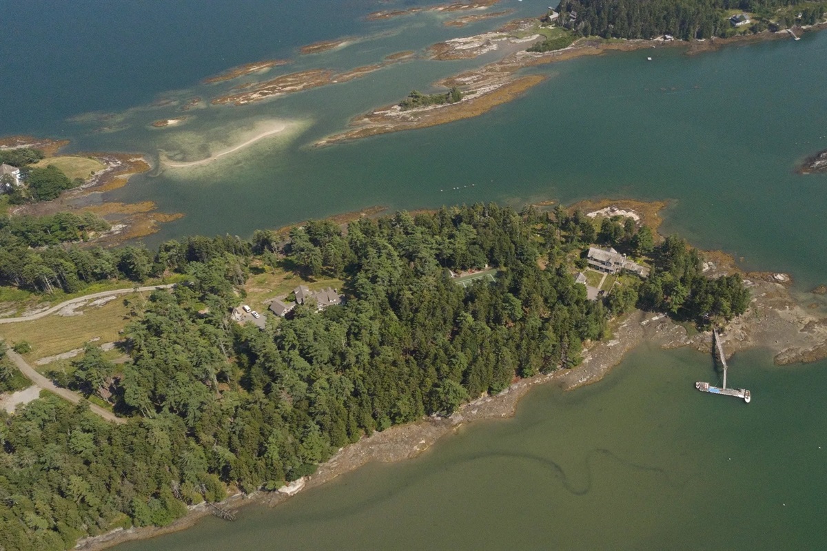 The Compound -The Maine House on the right, the Tennis Court in the middle, The Owner's residence on the left.