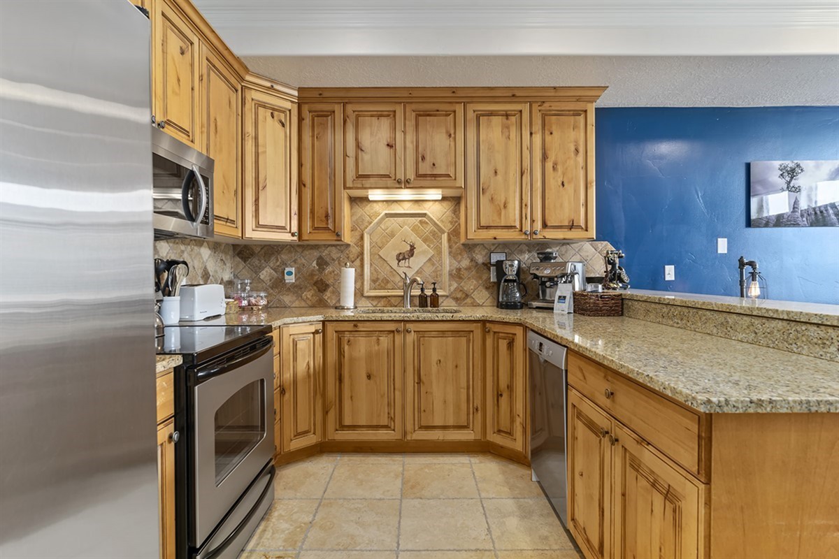 Fully equipped and thoughtfully designed, this kitchen offers generous prep space and upscale finishes that make every meal feel like a culinary experience.