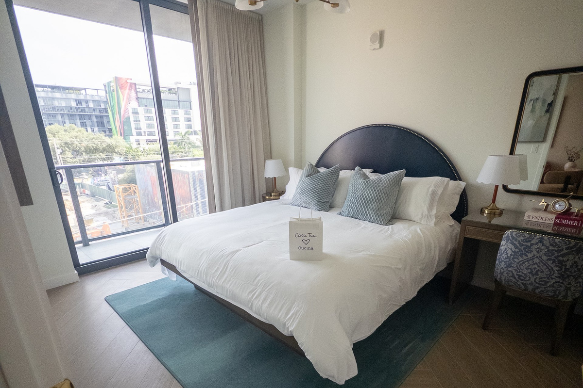 Wake up to city views pouring through floor-to-ceiling windows beside the king bed.