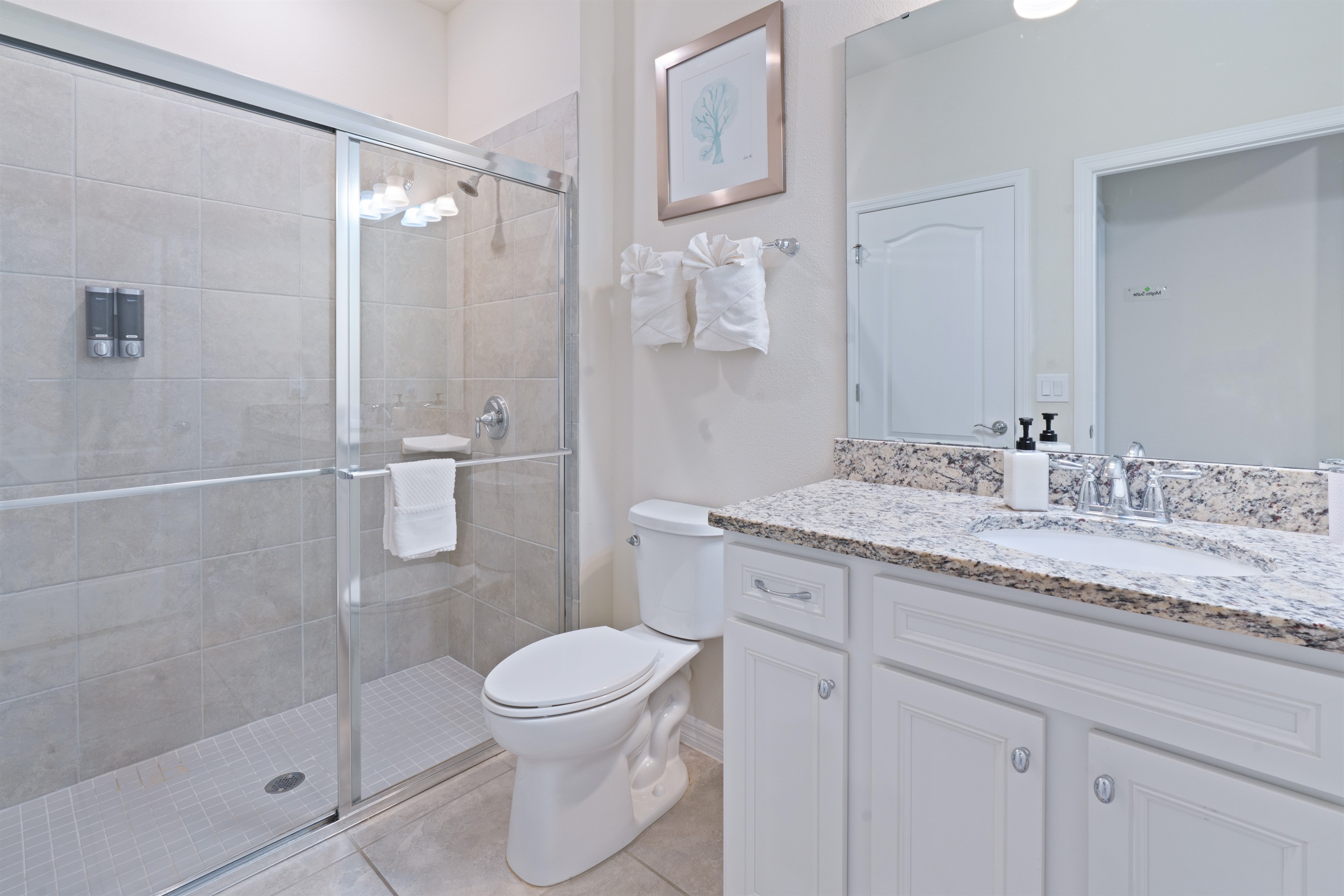 Downstairs ensuite bathroom with body wash, shampoo, conditioner, hand soap, hairdryer in every bathroom for your convenience.