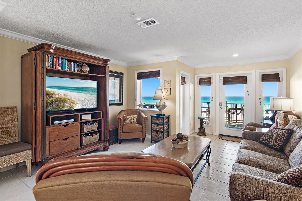 2nd Floor has the Primary Living Space with a comfortable, Gulf View living room with tons of seating around a 55" Smart TV!