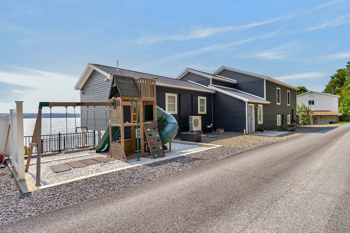 Street-side exterior with fenced play area
