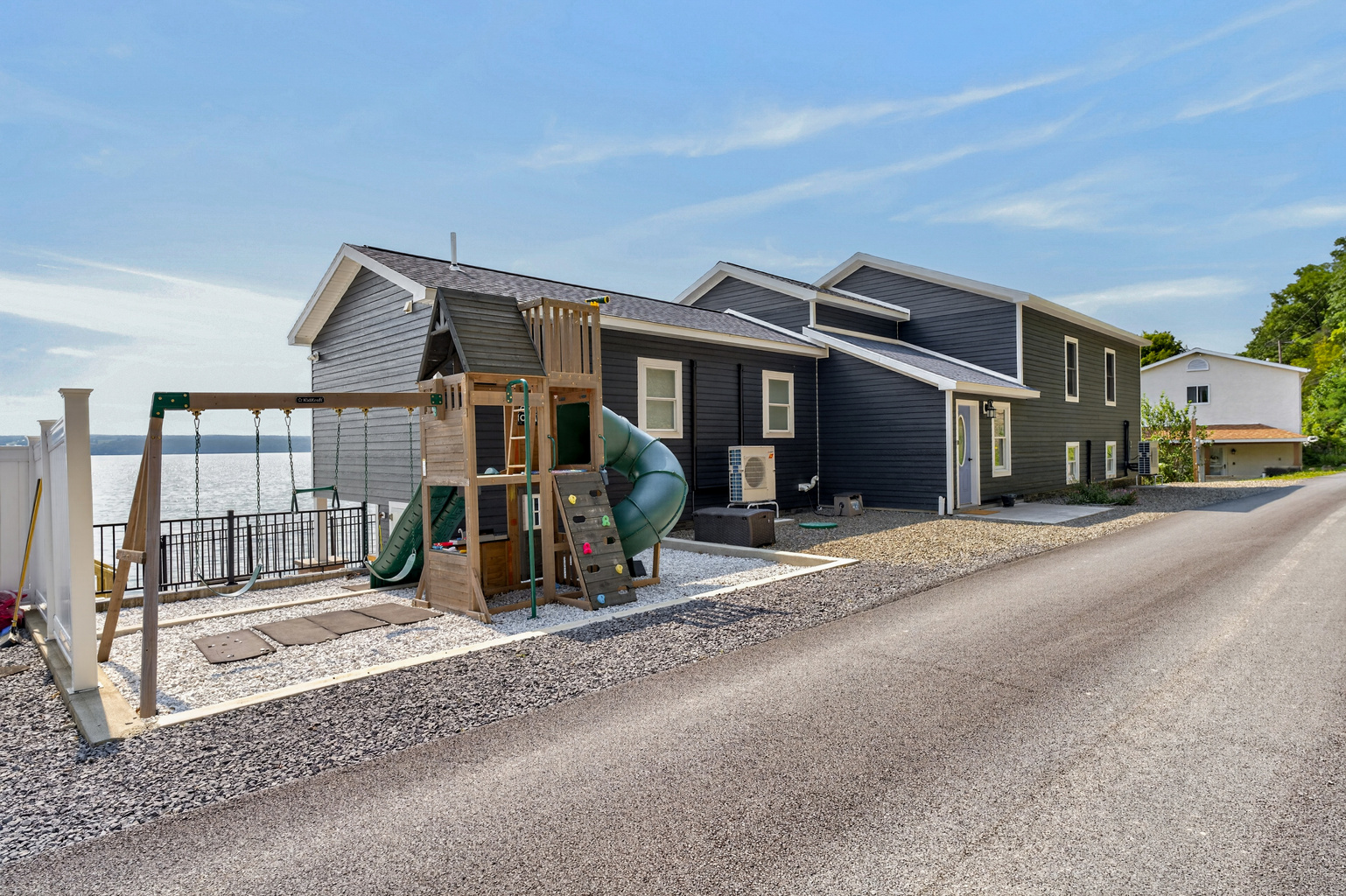Street-side exterior with fenced play area