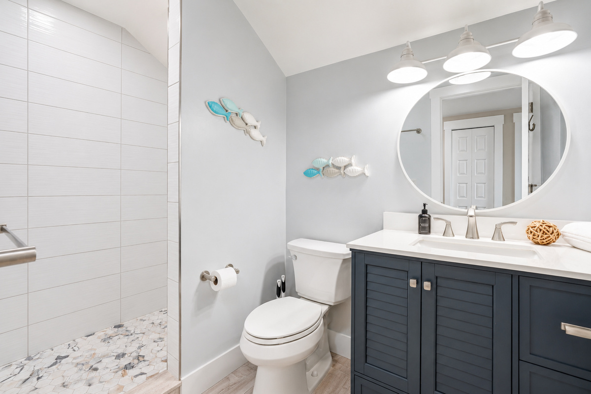 Complete with a spacious walk-in shower, vanity, and all the essentials, this private bathroom makes the third-floor retreat ideal for families, kids, or larger groups sharing the space.