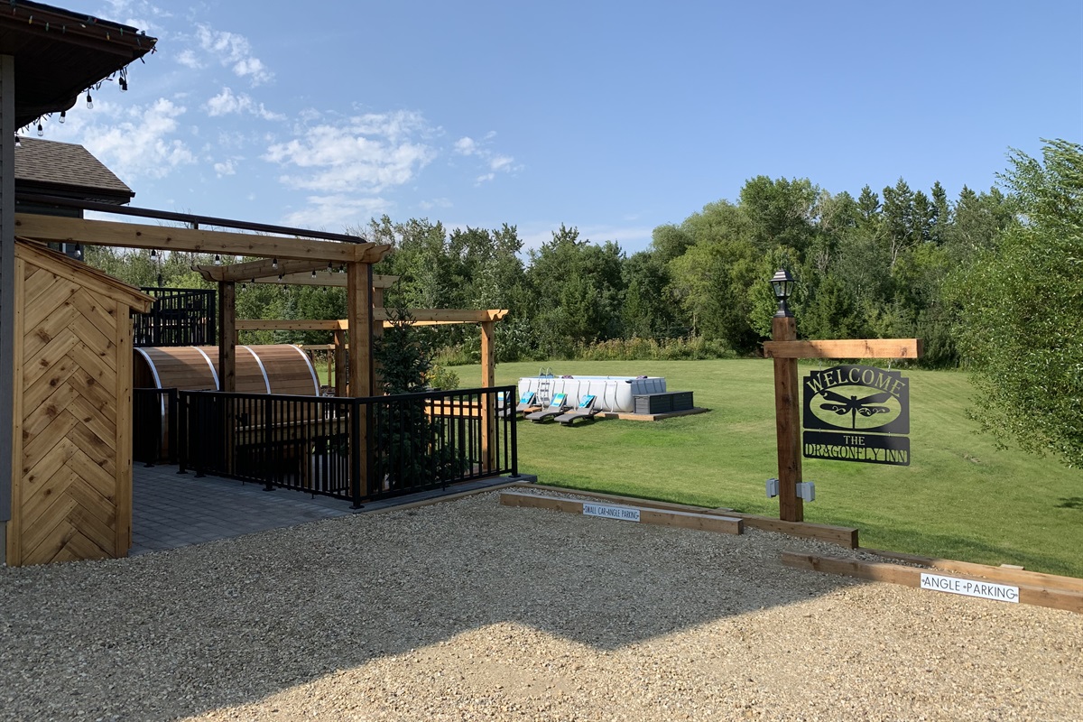 ENTRY AND GUEST PARKING. 3 ANGLE PARKING STALLS AVAILABLE. POWER PLUGS FOR WINTER ON SIGN POST.