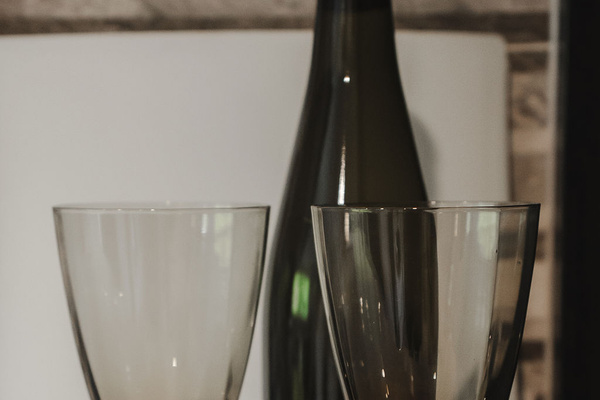 Layered place settings, textured placemats and polished glassware bring a welcoming dining detail to Fernhill Mountain Escape.