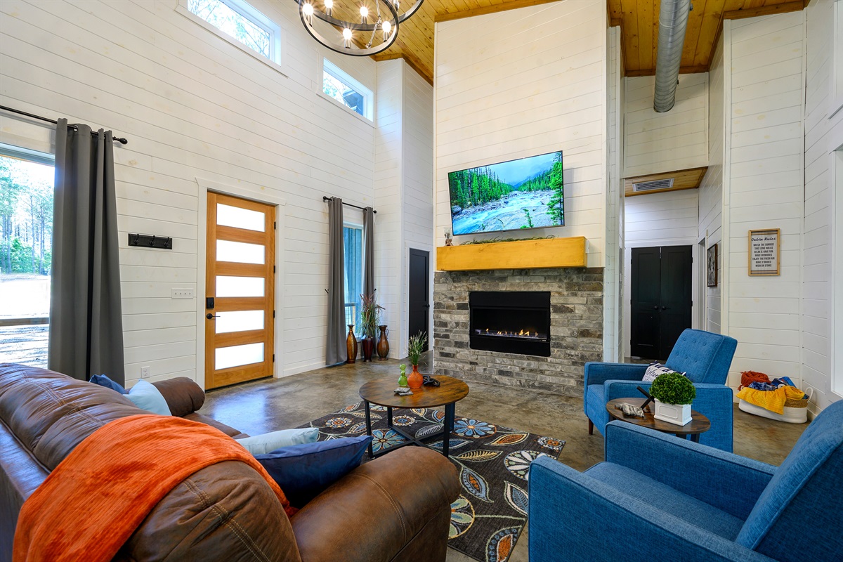 Cozy up by the fire with plush pillows and soft throws — your perfect cabin comfort spot. 🔥🕯️