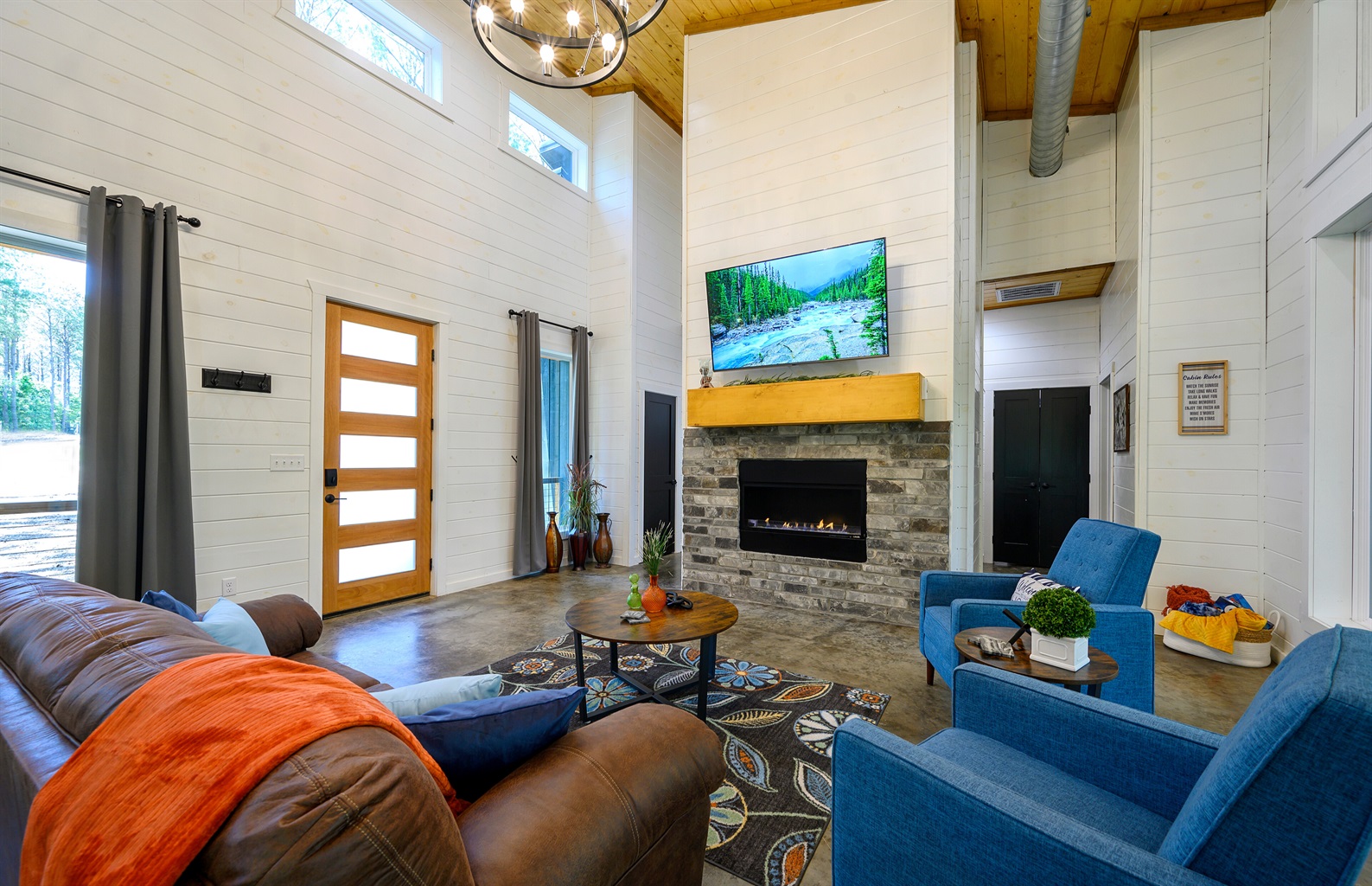 Cozy up by the fire with plush pillows and soft throws — your perfect cabin comfort spot. 🔥🕯️