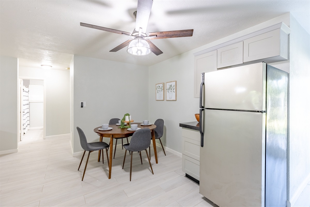 Bright kitchen featuring a cozy table set for four guests.